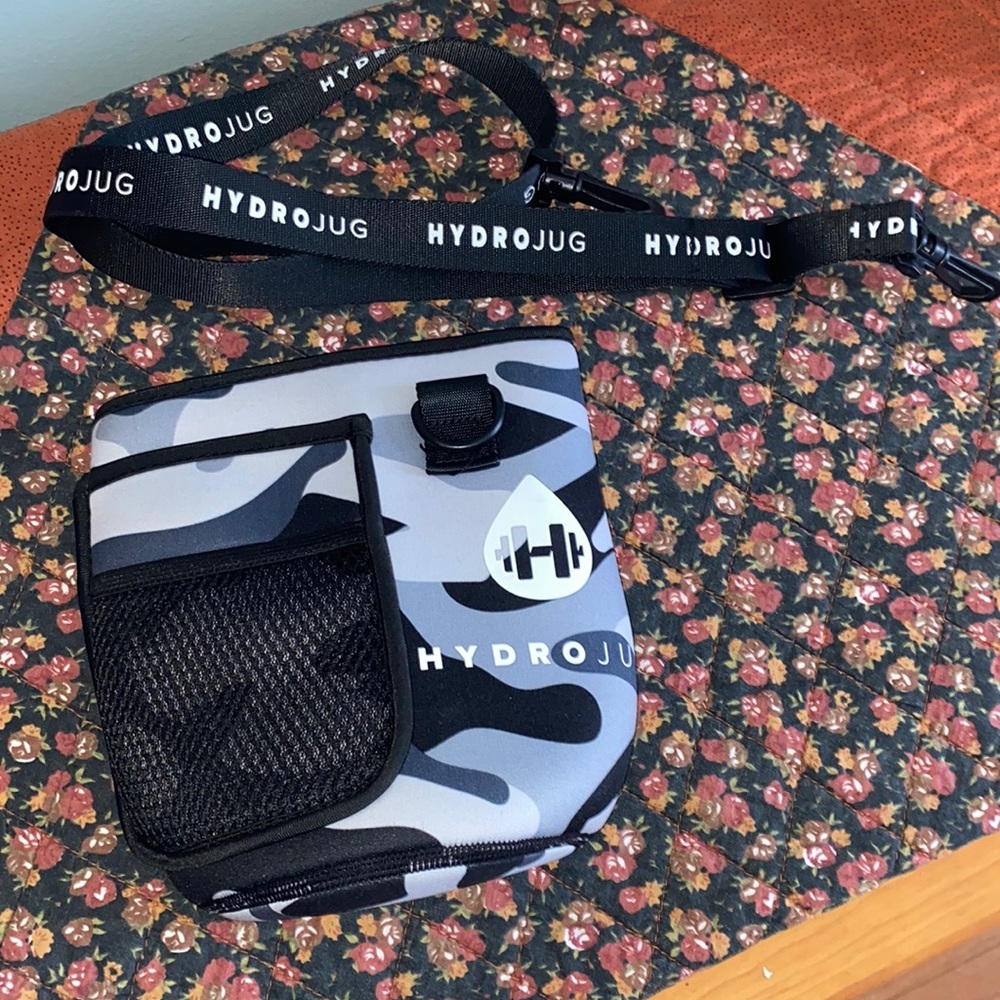Black/Gray/White Camo Hydrojug sleeve with a black carrying strap